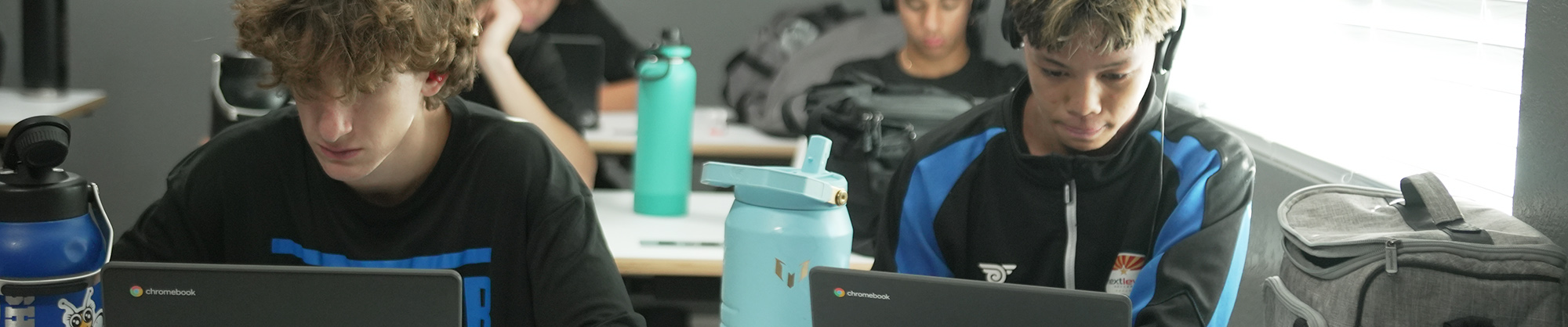 Students wearing headphones in a classroom